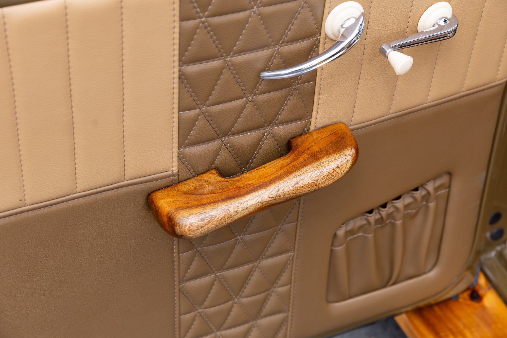 Custom Koa wood armrests were sculpted by Campbell High School teacher David Perreira.