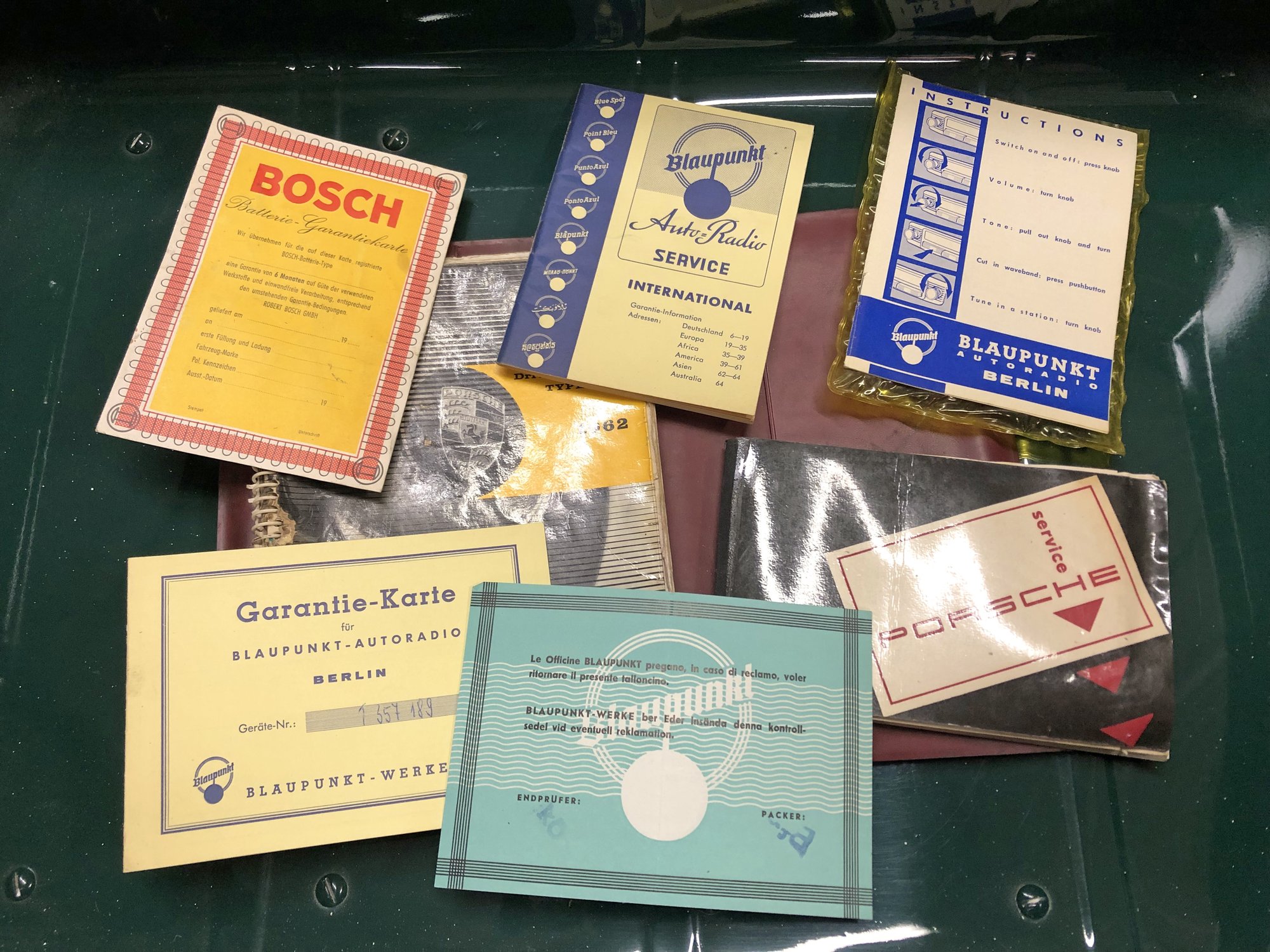 Brochures, service records, owner's manuals - several documents from the 1960s.